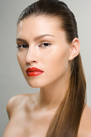 Portrait of a woman wearing red lipstick --- Image by © Image Source/Corbis